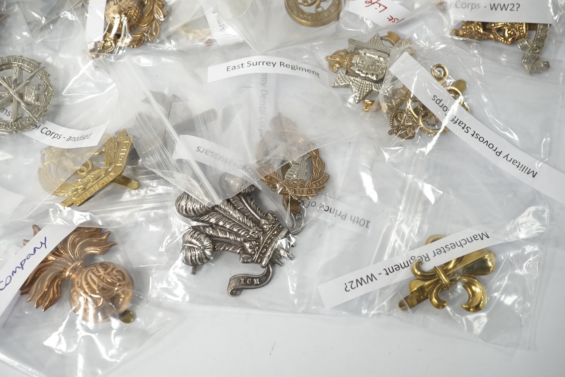 Forty military cap badges including; the Cambridgeshire regiment, Intelligence Corps, King’s Rifle Corps, Army Catering Corps, Small Arms School Corps, Duke of Wellington’s West Riding regiment, Royal Military College, R